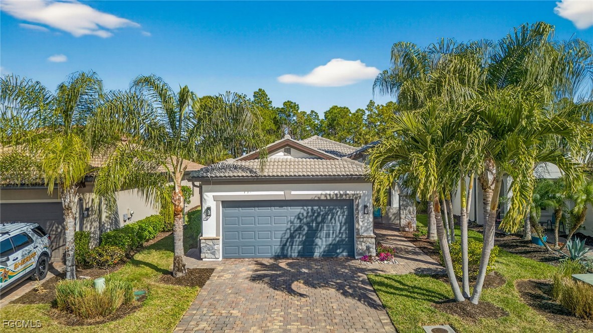 11268 Carlingford Road Fort Myers, FL 33913 - Photo 29 of 48 a front view of a house with garden