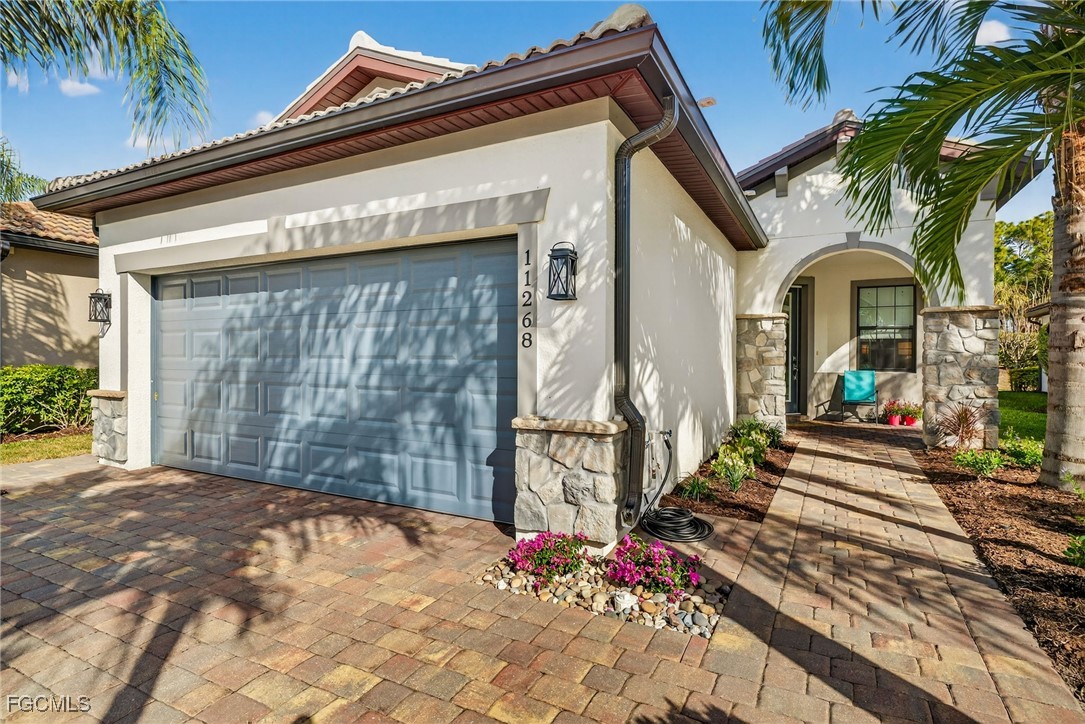 11268 Carlingford Road Fort Myers, FL 33913 - Photo 3 of 48 a view of a house with a small backyard