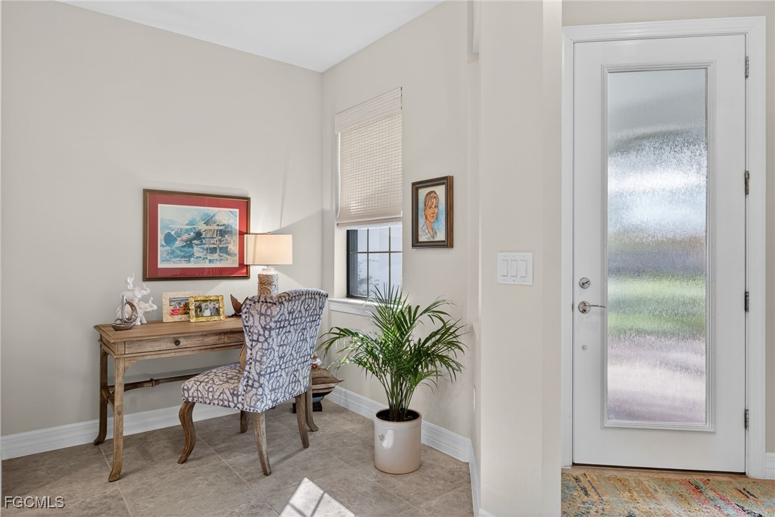 11268 Carlingford Road Fort Myers, FL 33913 - Photo 8 of 48 a living room with furniture potted plant and a mirror