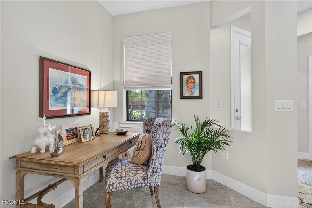 11268 Carlingford Road Fort Myers, FL 33913 - Photo 9 of 48 a living room with furniture potted plant and a window