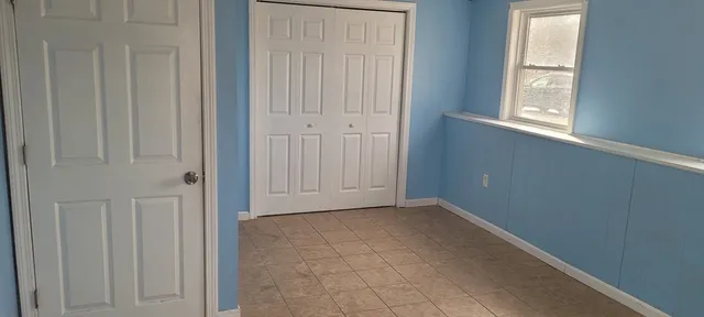 a view of an empty room with windows