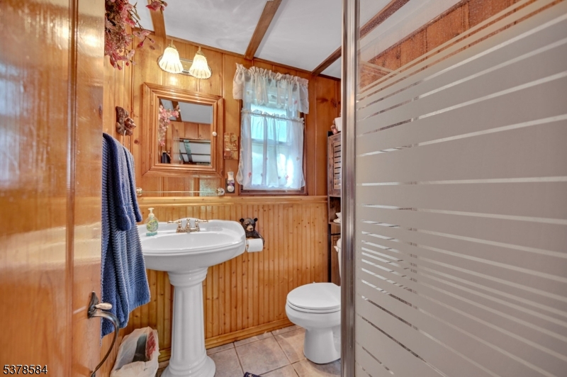 134 Birch Road Vernon, NJ 07422 - Photo 15 of 49 a bathroom with a toilet sink and mirror
