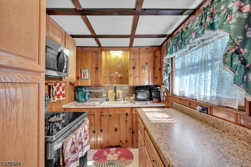 134 Birch Road Vernon, NJ 07422 - Photo 17 of 49 a kitchen that has a lot of cabinets in it
