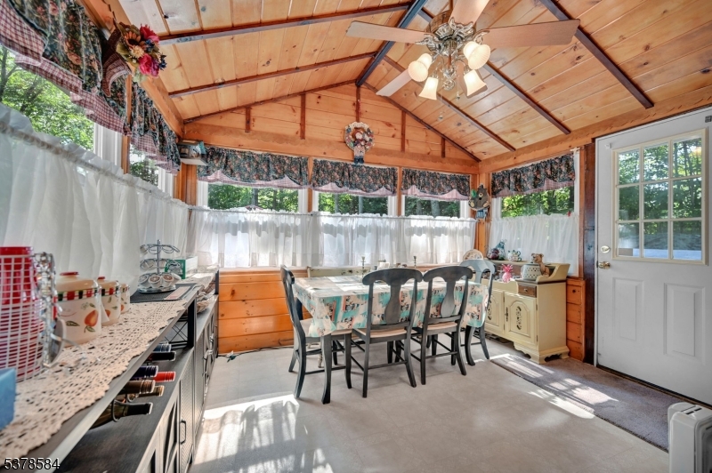 134 Birch Road Vernon, NJ 07422 - Photo 22 of 49 a patio with glass top table and chairs