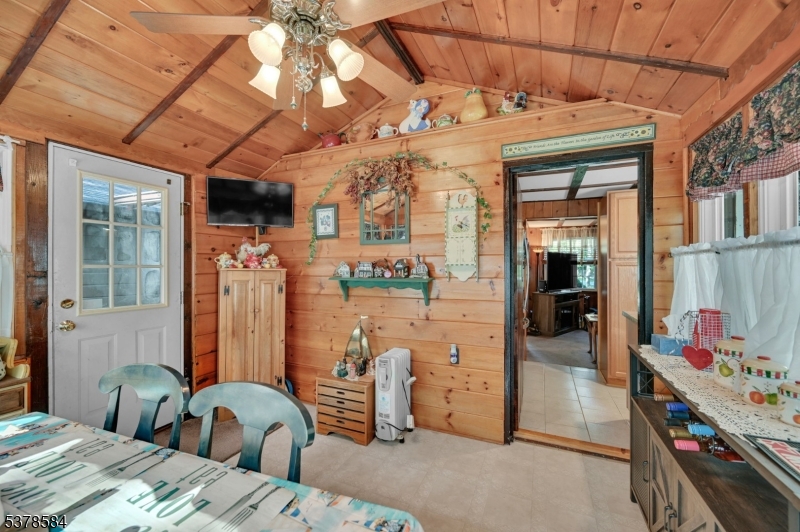 134 Birch Road Vernon, NJ 07422 - Photo 25 of 49 a bedroom with furniture and a chandelier