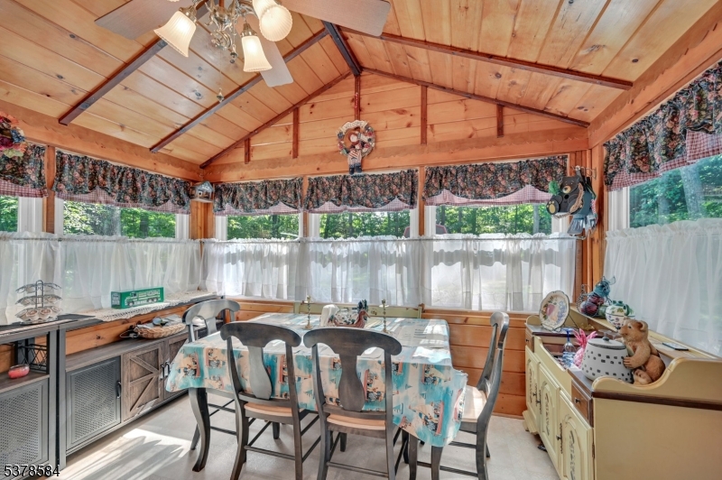 134 Birch Road Vernon, NJ 07422 - Photo 27 of 49 a outdoor dining space with furniture and umbrella
