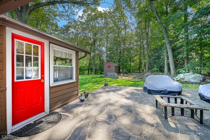 134 Birch Road Vernon, NJ 07422 - Photo 28 of 49 a view of a chair and table in backyard of the house