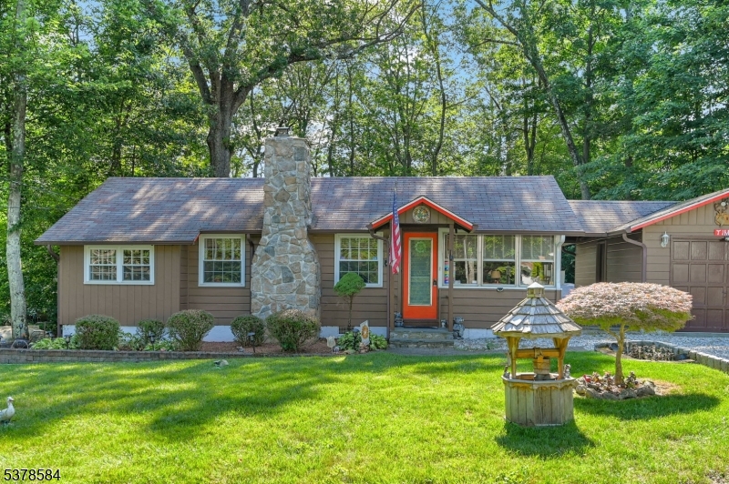 134 Birch Road Vernon, NJ 07422 - Photo 3 of 49 a front view of a house with a garden