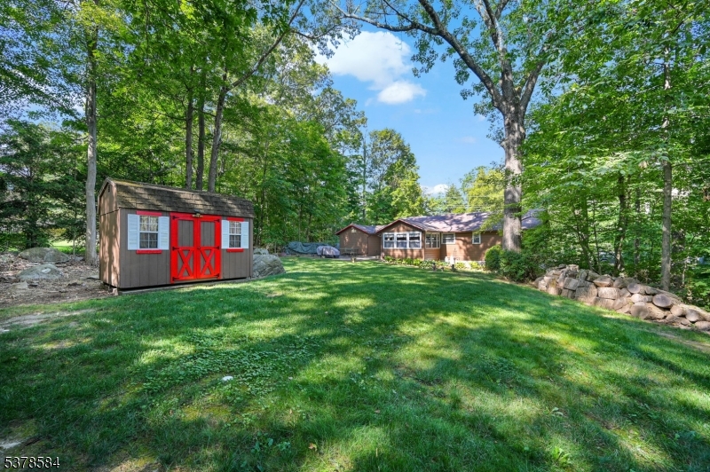 134 Birch Road Vernon, NJ 07422 - Photo 32 of 49 a view of a house with a yard and a tree