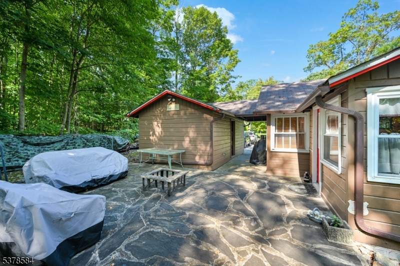 134 Birch Road Vernon, NJ 07422 - Photo 35 of 49 a view of house with backyard and outdoor seating