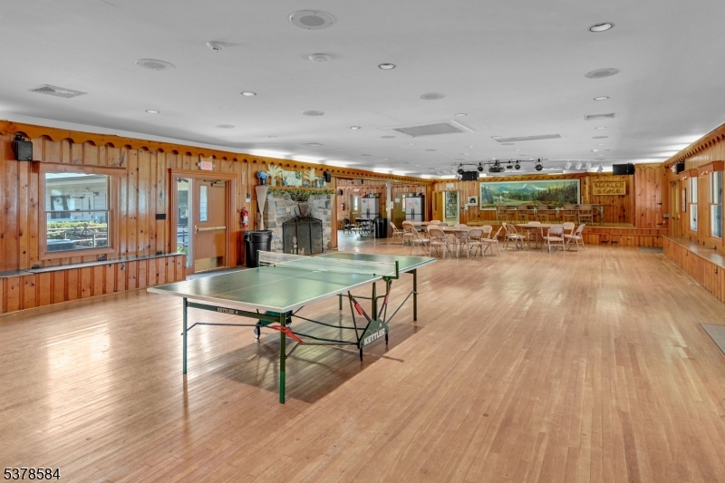 134 Birch Road Vernon, NJ 07422 - Photo 38 of 49 a living room with lots of furniture and wooden floor