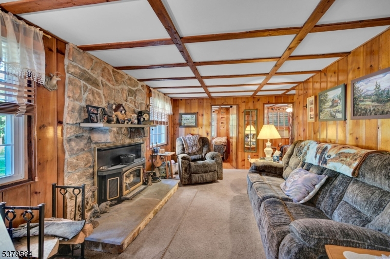 134 Birch Road Vernon, NJ 07422 - Photo 9 of 49 a living room with furniture a fireplace and next to a window
