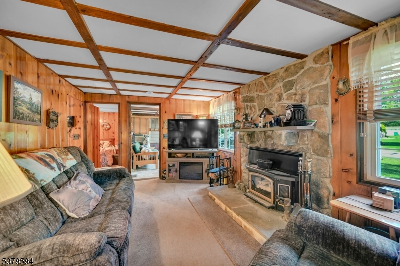 134 Birch Road Vernon, NJ 07422 - Photo 10 of 49 a living room with furniture and a flat screen tv