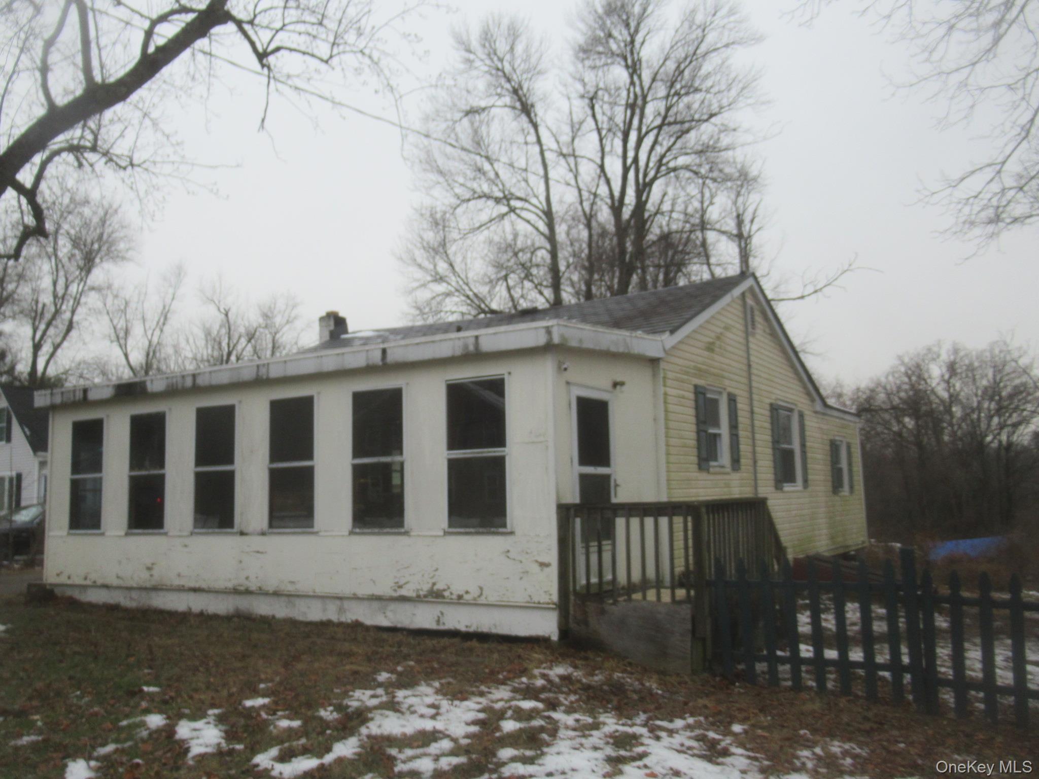 162 Osborne Hill Road Fishkill, NY 12524 - Photo 1 of 11 Snow covered property featuring a wooden deck and a chimney