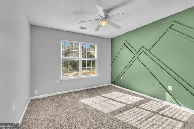 a view of a room that has a window in it