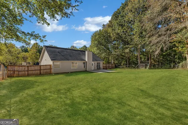 a view of backyard with green space
