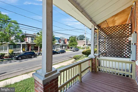 a view of a balcony with car parked