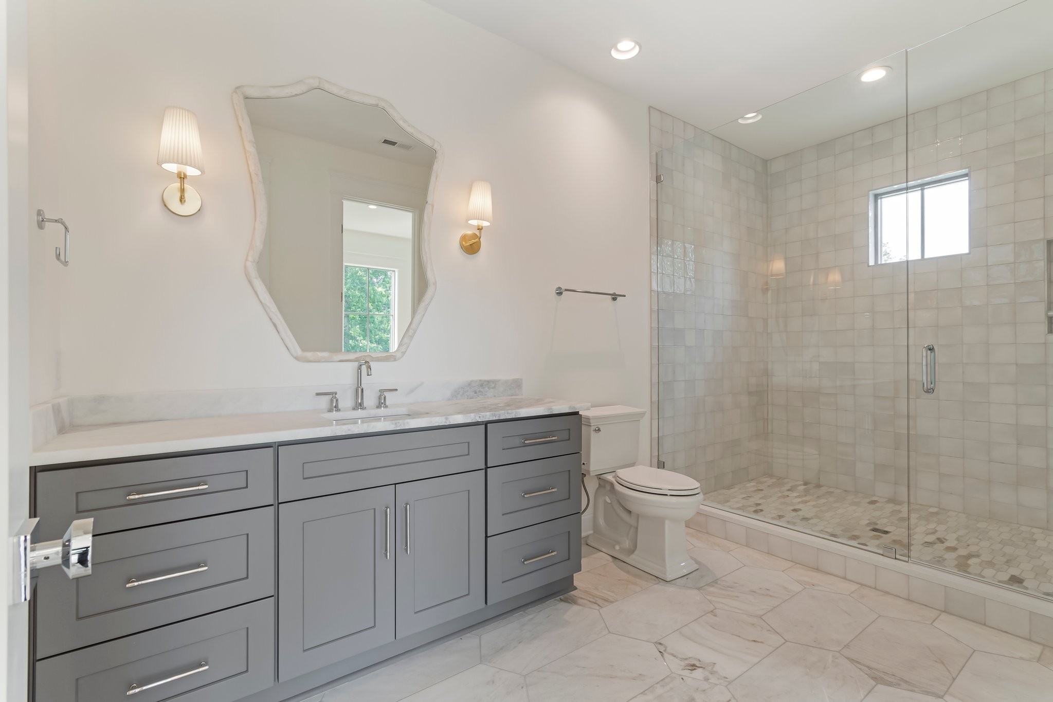 4035 Sneed Road Nashville, TN 37215 - Photo 42 of 64 a bathroom with a double vanity sink toilet and shower