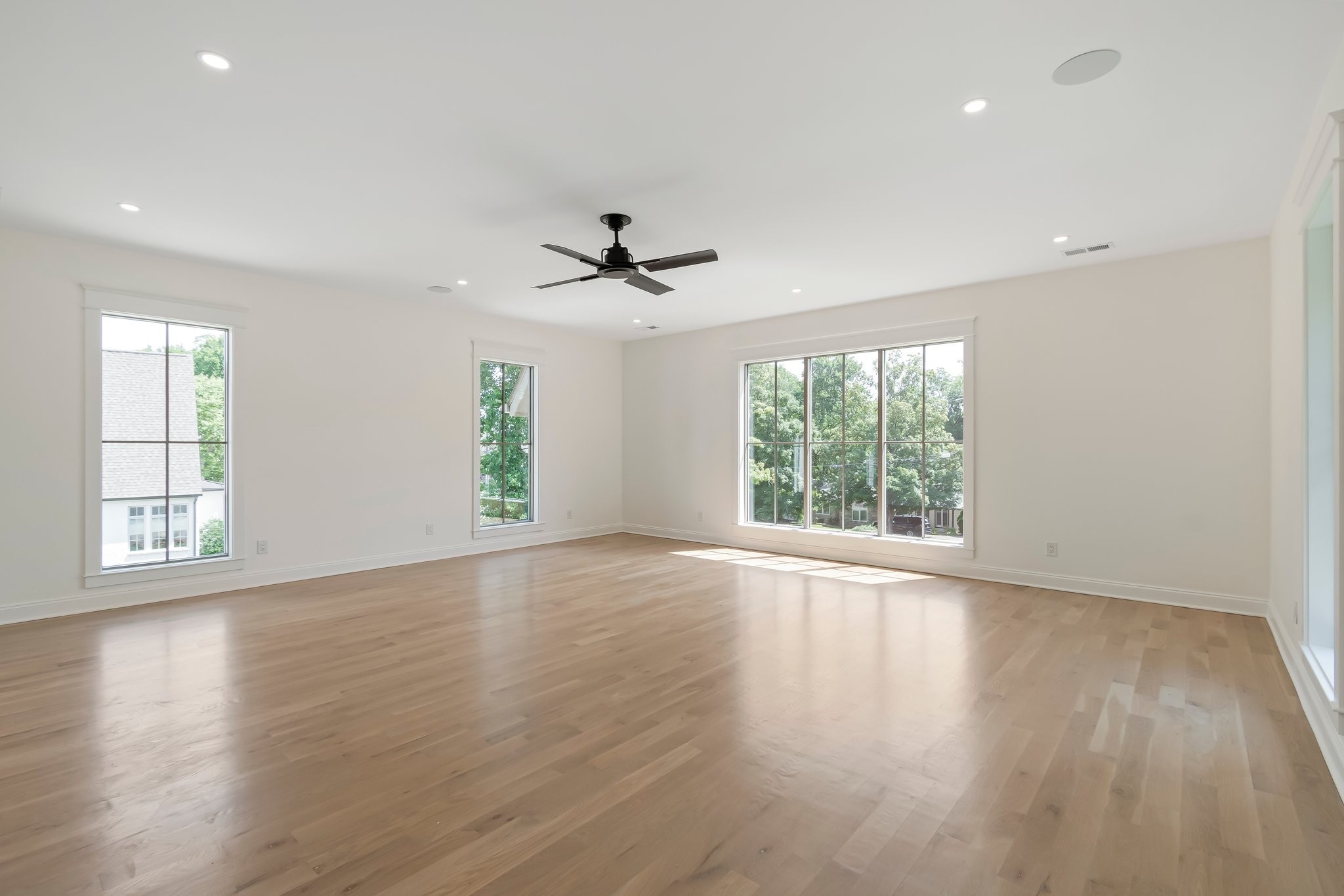 4035 Sneed Road Nashville, TN 37215 - Photo 46 of 64 a view of an empty room with wooden floor and a window