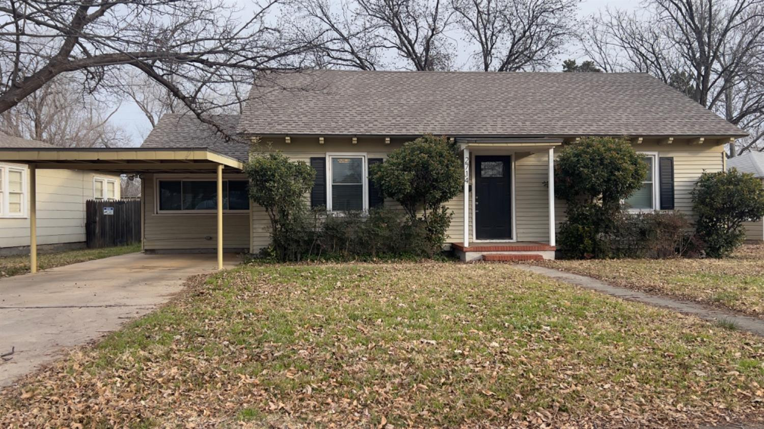 2714 29th Street Lubbock, TX 79410 - Photo 1 of 20 a front view of a house with garden