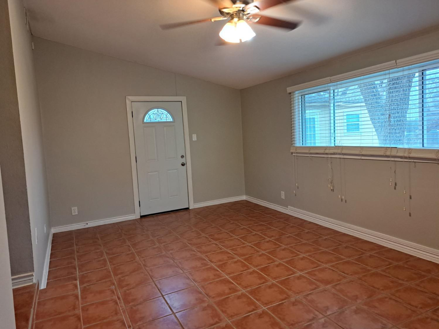 2714 29th Street Lubbock, TX 79410 - Photo 12 of 20 a view of an empty room with a window