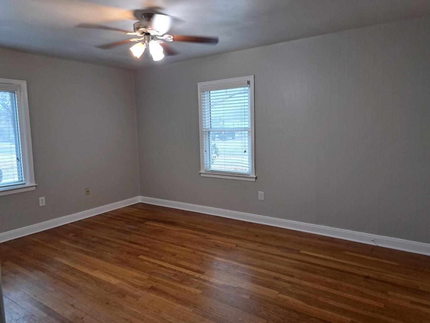 2714 29th Street Lubbock, TX 79410 - Photo 4 of 20 a view of a room with wooden floor and windows