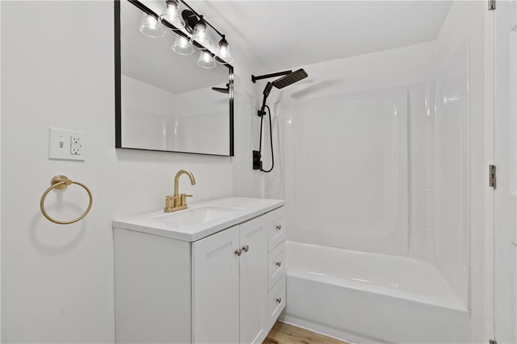 1200 Burchfield Road Allison Park, PA 15101 - Photo 16 of 19 a bathroom with a granite countertop sink a toilet and shower
