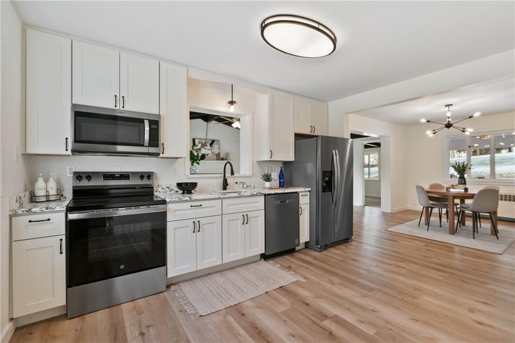 1200 Burchfield Road Allison Park, PA 15101 - Photo 2 of 19 a kitchen with a refrigerator stove and microwave