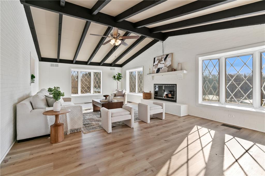 1200 Burchfield Road Allison Park, PA 15101 - Photo 4 of 19 a living room with furniture a fireplace and a floor to ceiling window