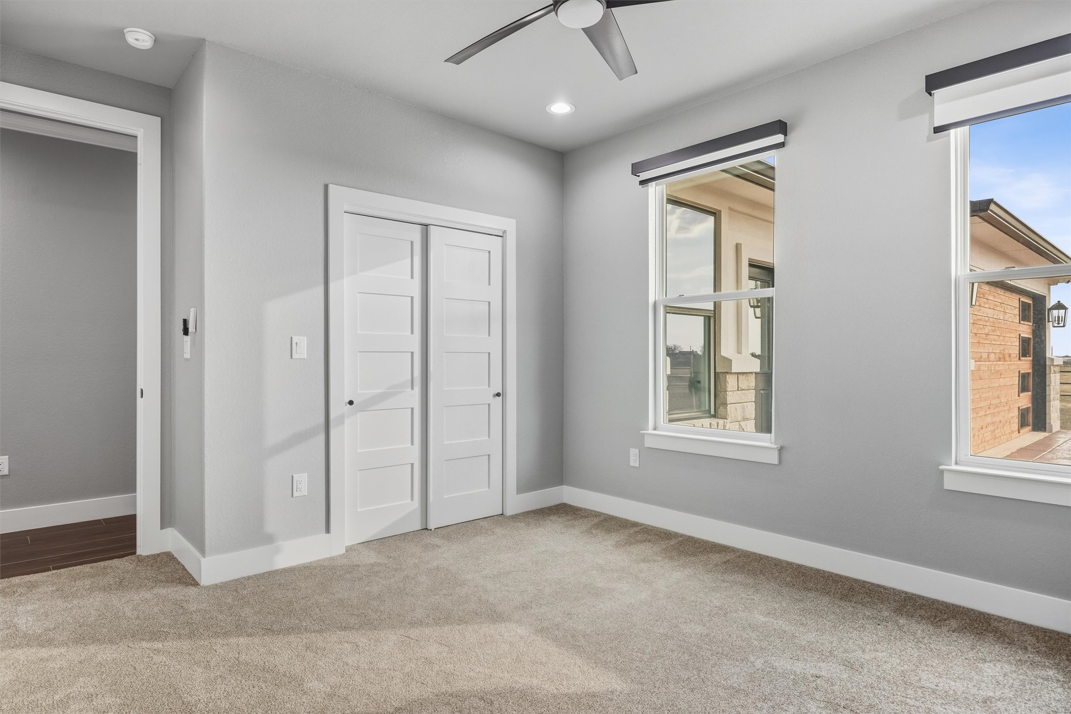 178 Balch Road Elgin, TX 78621 - Photo 26 of 40 an empty room with windows and closet