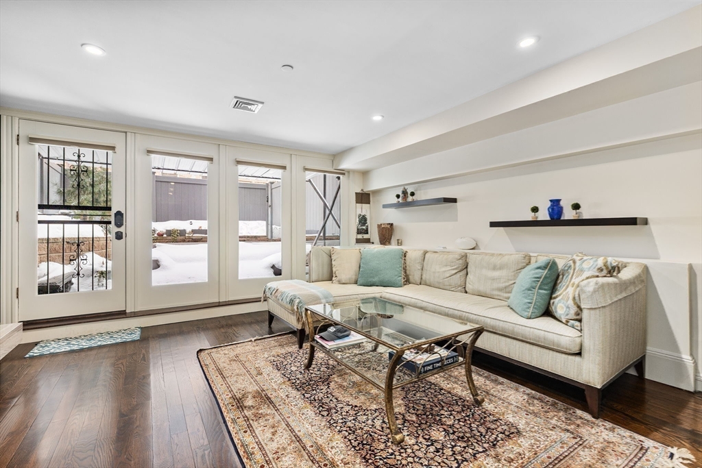 109 Appleton Street Boston, MA 02116 - Photo 20 of 26 a living room with furniture and wooden floor