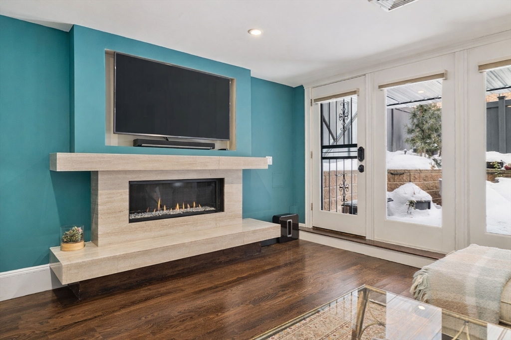 109 Appleton Street Boston, MA 02116 - Photo 21 of 26 a living room with furniture fireplace and flat screen tv