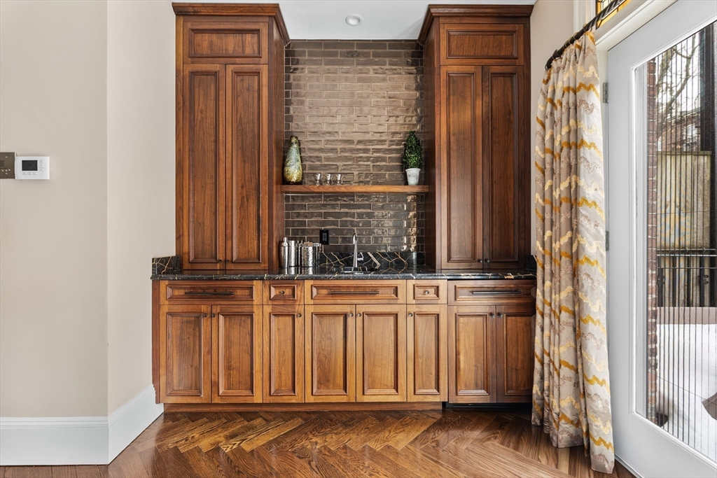 109 Appleton Street Boston, MA 02116 - Photo 5 of 26 a view of a door with wooden floor and chair