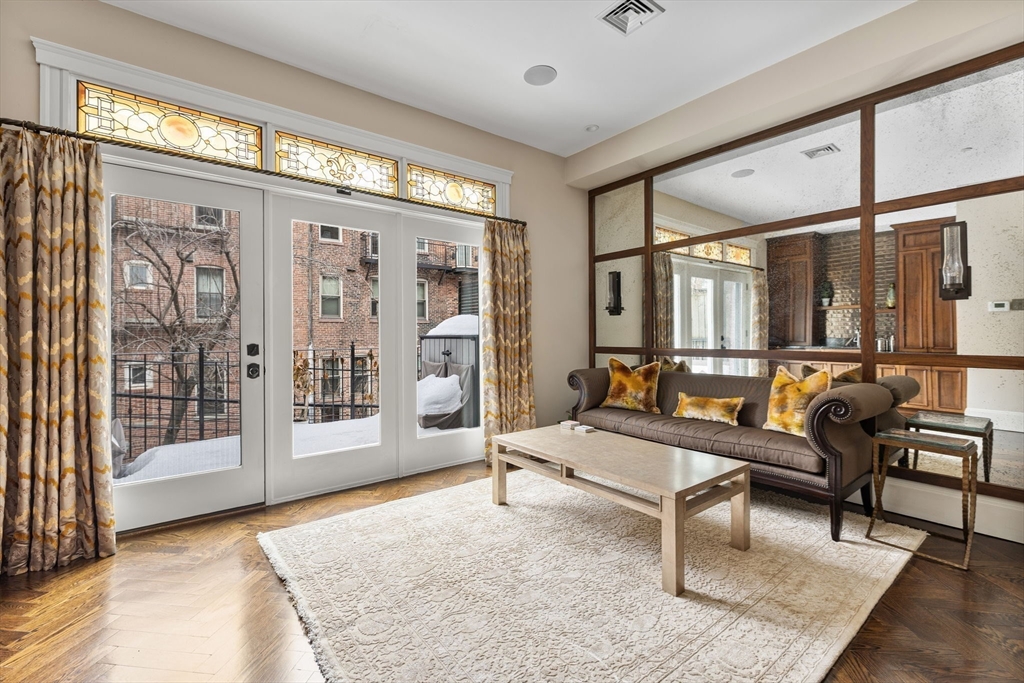 109 Appleton Street Boston, MA 02116 - Photo 6 of 26 a living room with furniture and a large window