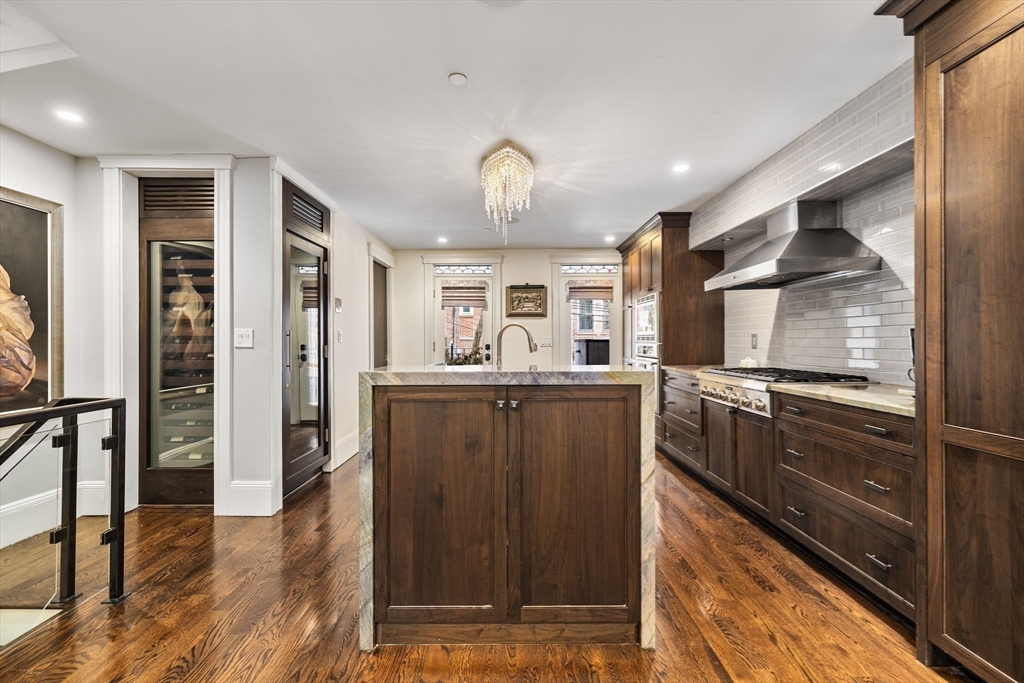 109 Appleton Street Boston, MA 02116 - Photo 9 of 26 a kitchen with a refrigerator and a sink