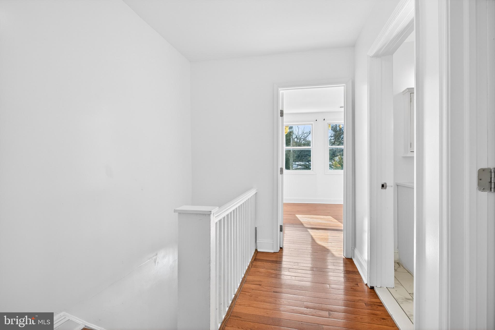 5119 Sheldon Street Philadelphia, PA 19144 - Photo 11 of 27 a view of a hallway with wooden floor and staircase