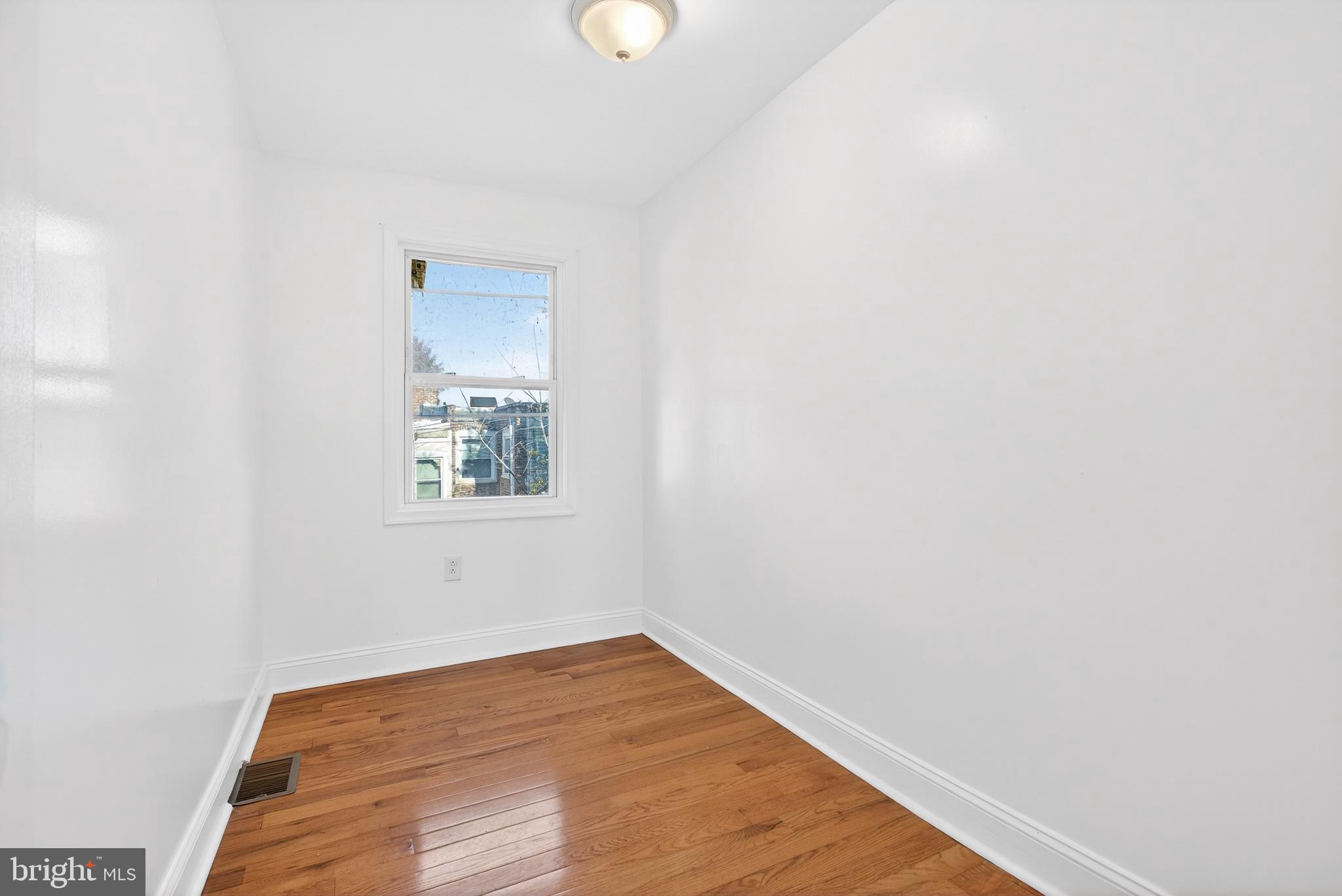 5119 Sheldon Street Philadelphia, PA 19144 - Photo 13 of 27 a view of a small space with wooden floor and a window