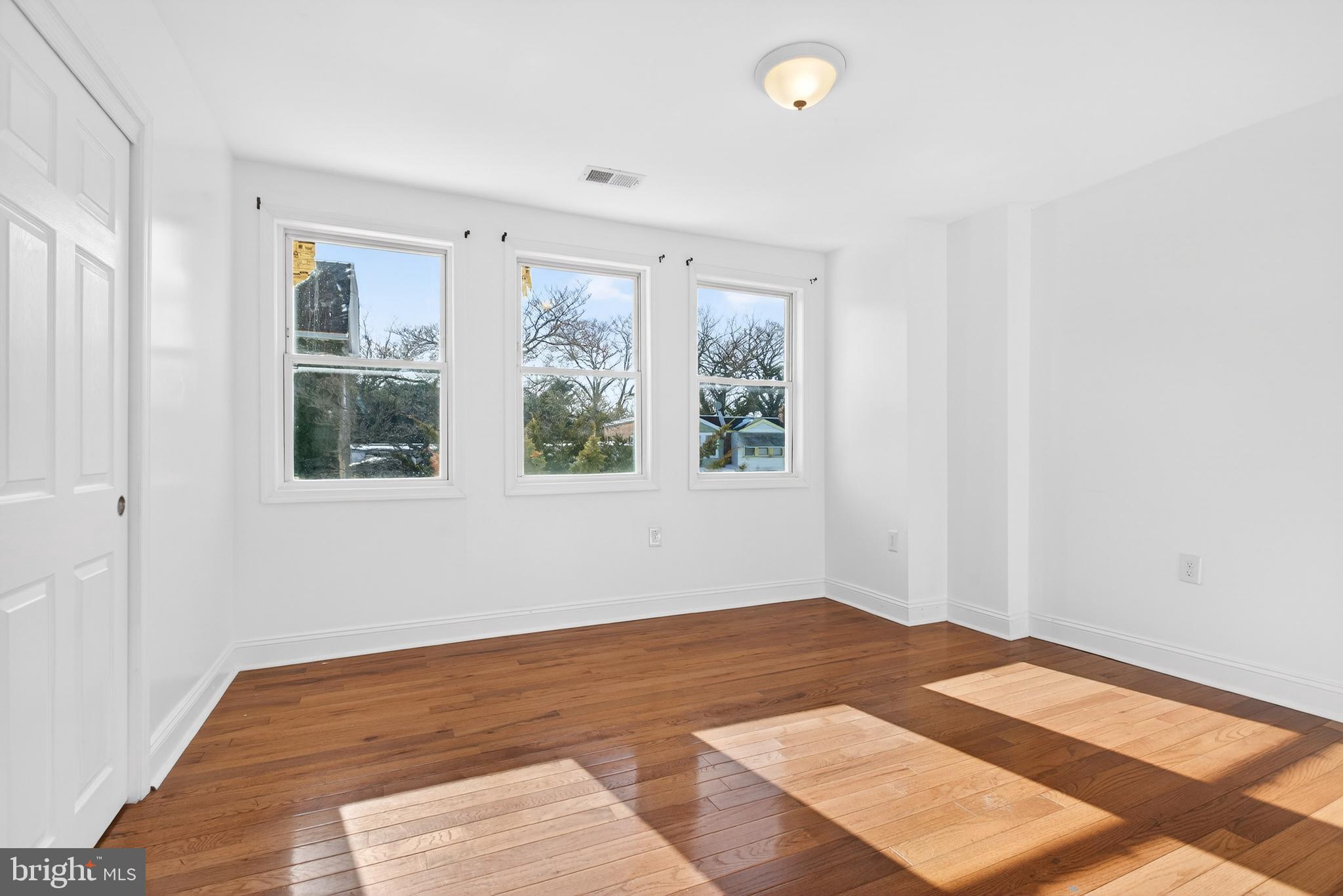 5119 Sheldon Street Philadelphia, PA 19144 - Photo 19 of 27 a view of a room with wooden floor and windows