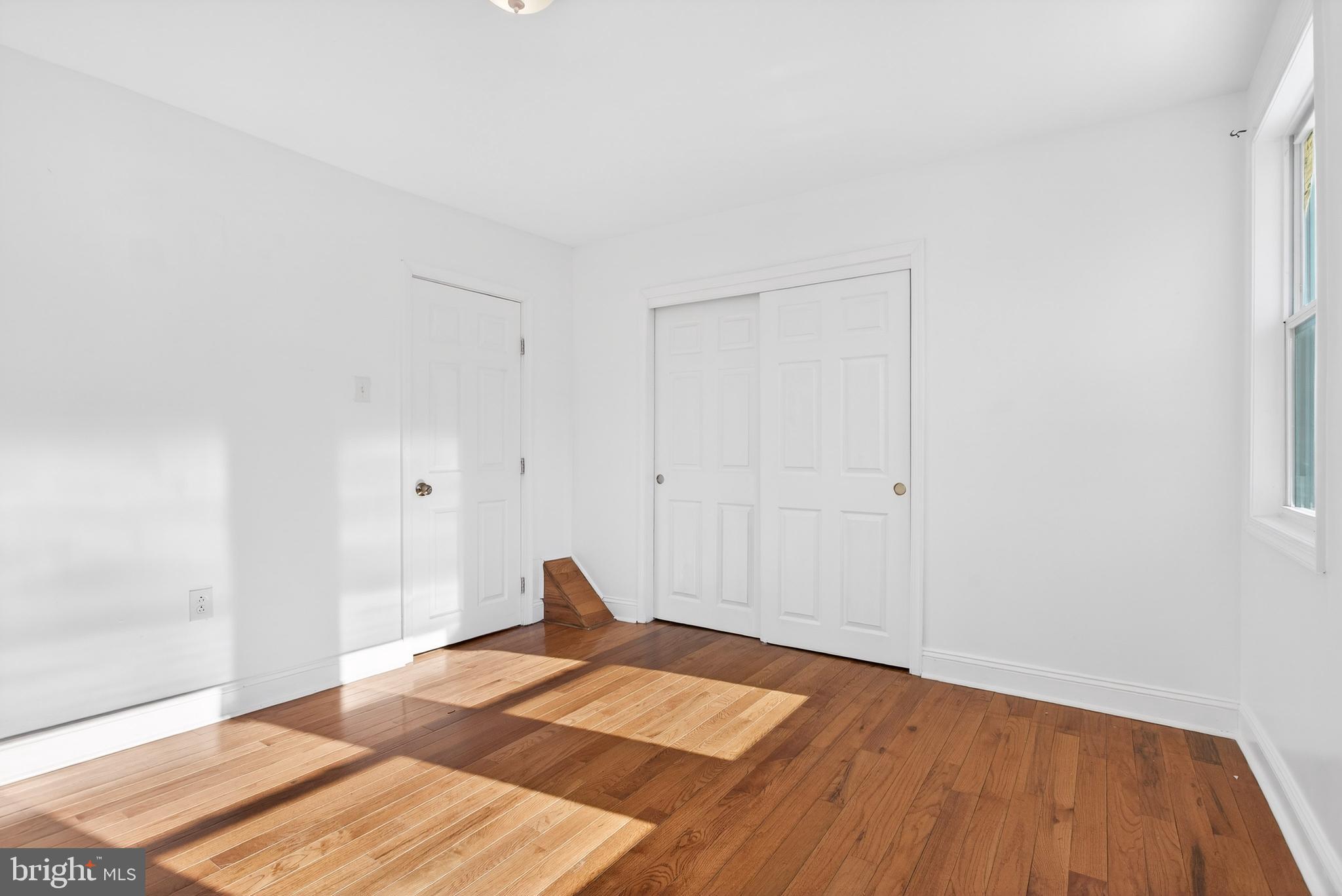 5119 Sheldon Street Philadelphia, PA 19144 - Photo 21 of 27 a view of a bedroom with wooden floor and bedroom