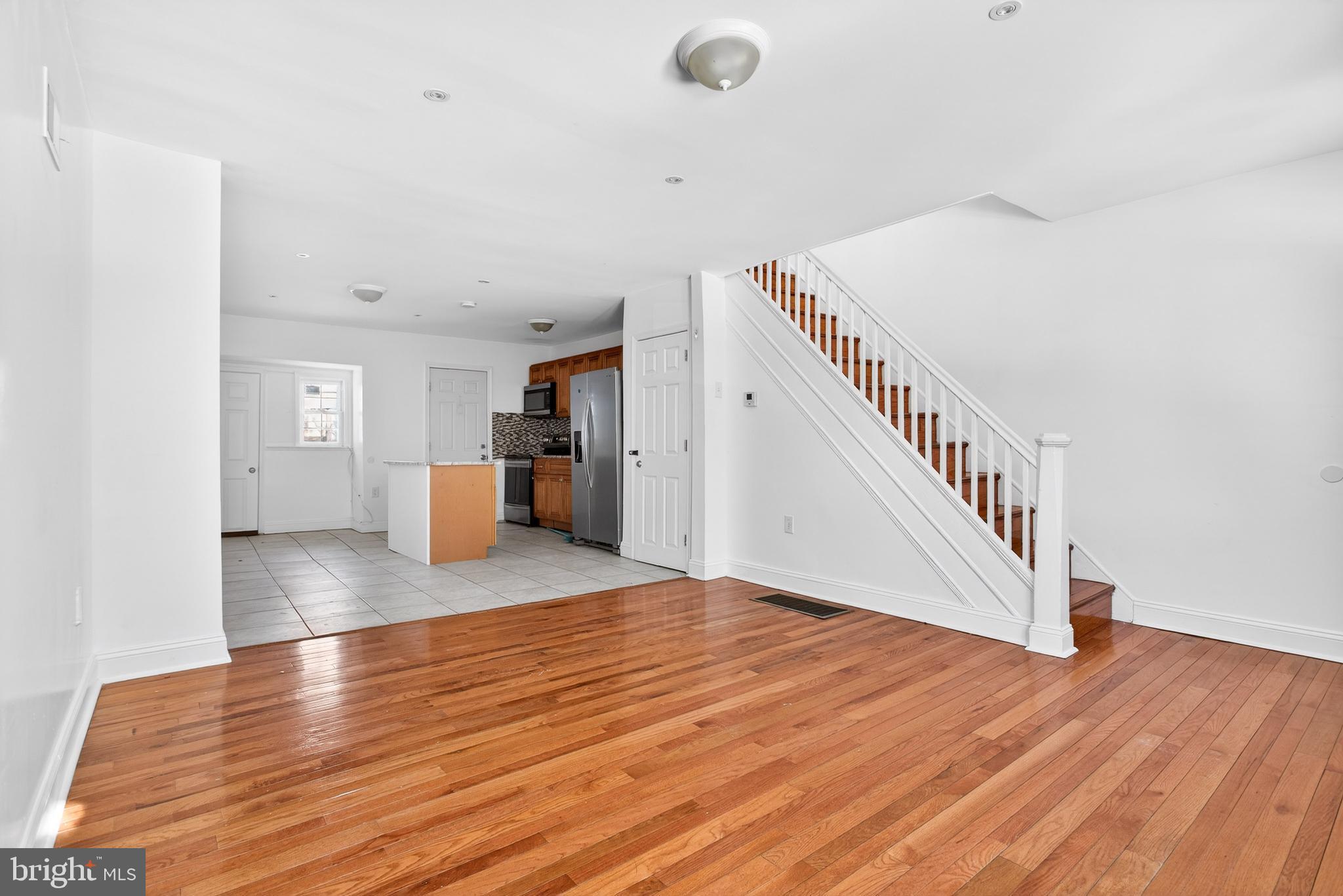 5119 Sheldon Street Philadelphia, PA 19144 - Photo 6 of 27 a view of kitchen and hall with wooden floor