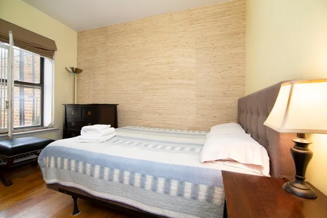 a kitchen with a sink cabinets and window