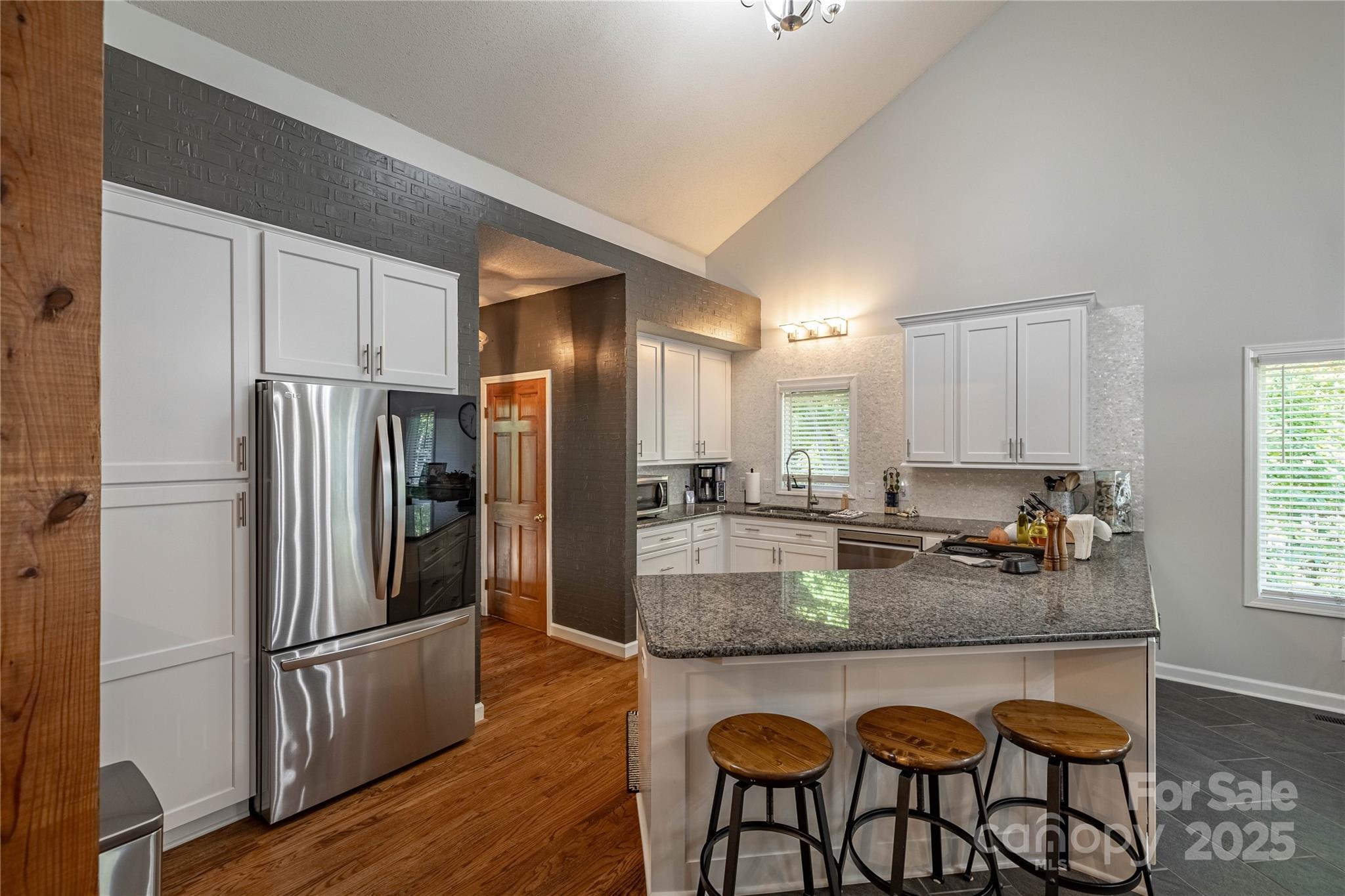316 Players Ridge Road Hickory, NC 28601 - Photo 22 of 47 a kitchen with refrigerator cabinets dining table and chairs