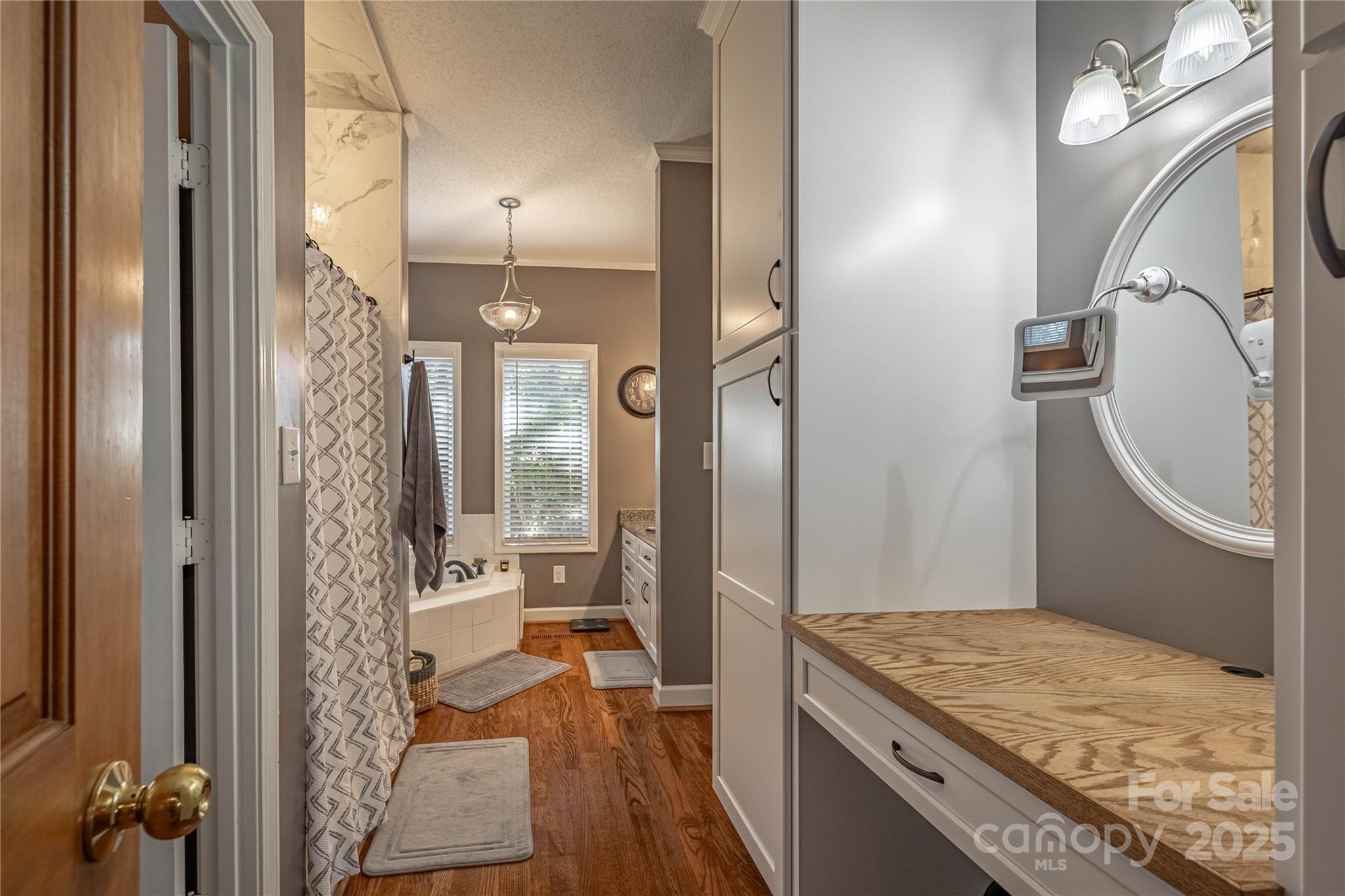 316 Players Ridge Road Hickory, NC 28601 - Photo 30 of 47 a bathroom with a granite countertop sink a toilet and shower
