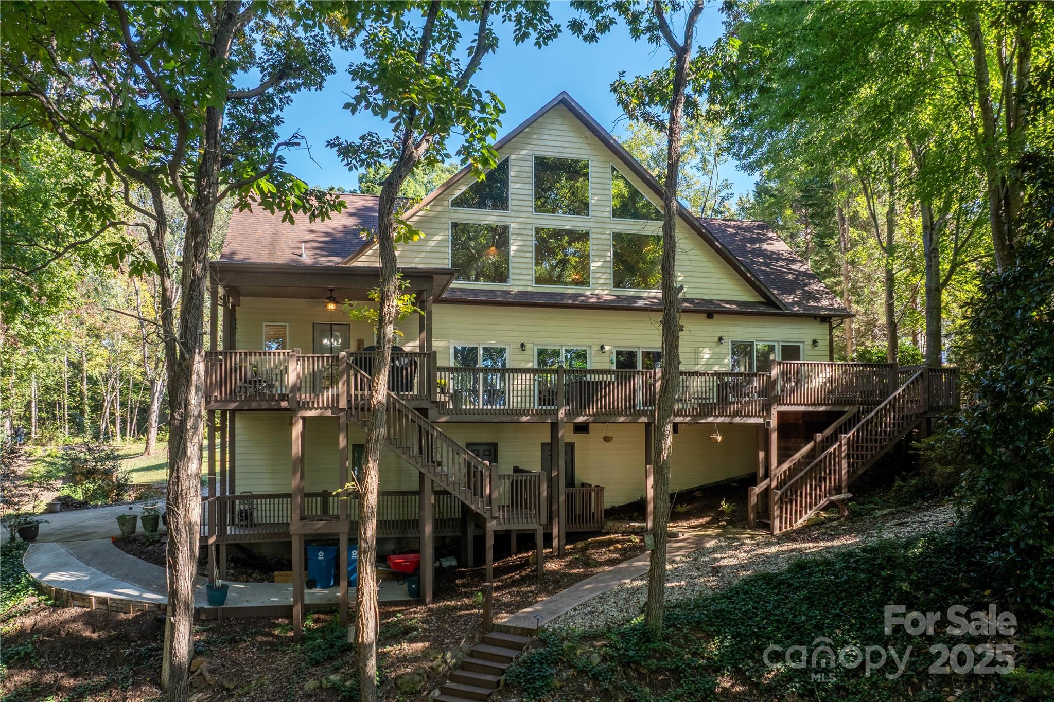 316 Players Ridge Road Hickory, NC 28601 - Photo 3 of 47 a view of a house with a porch and a tree