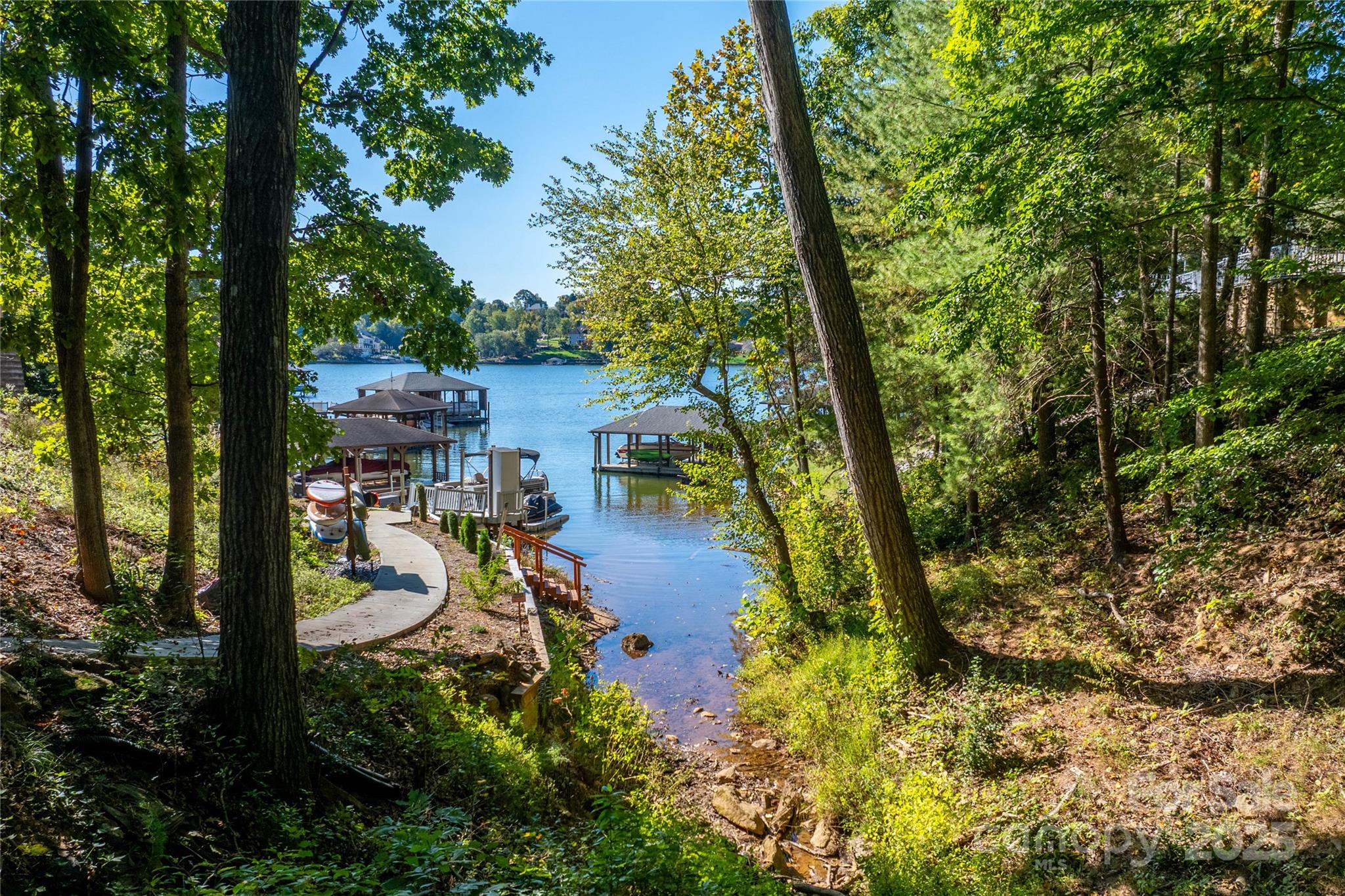 316 Players Ridge Road Hickory, NC 28601 - Photo 4 of 47 a view of a yard with plants and large trees