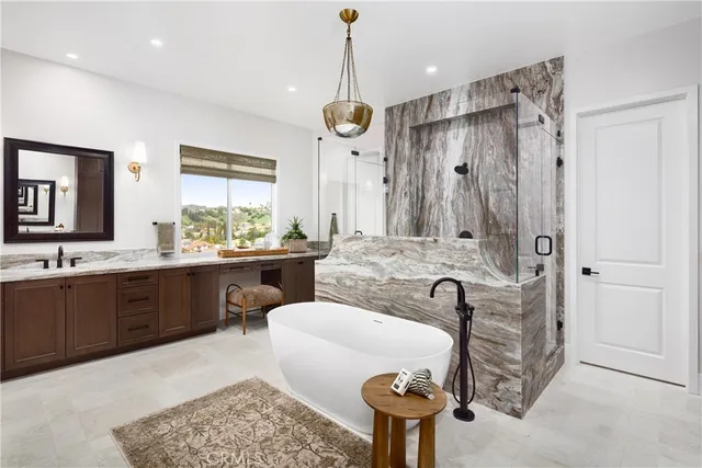 a bathroom with a double vanity sink mirror and toilet
