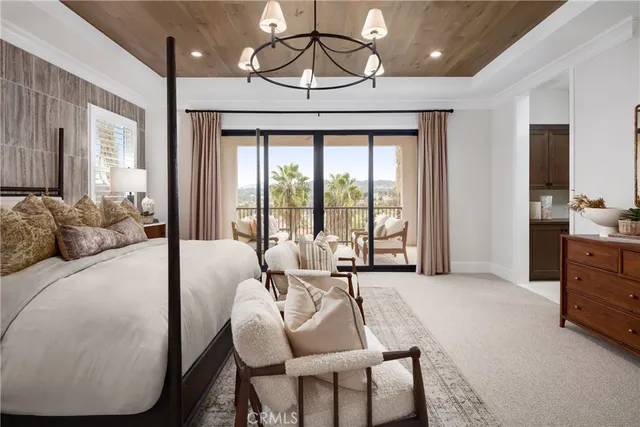 a living room with furniture and large windows