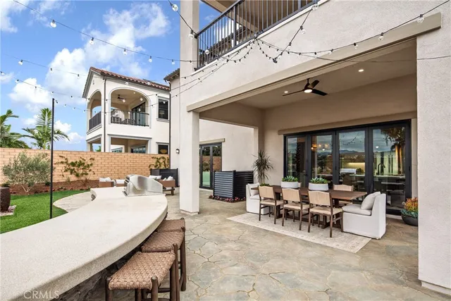 a building outdoor space with patio furniture and potted plants