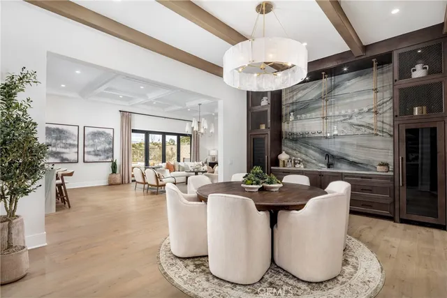 a living room with fireplace furniture and a large window