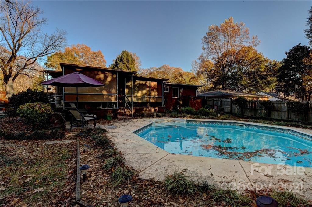 914 Burnley Road Charlotte, NC 28210 - Photo 8 of 28 a view of a swimming pool with a patio